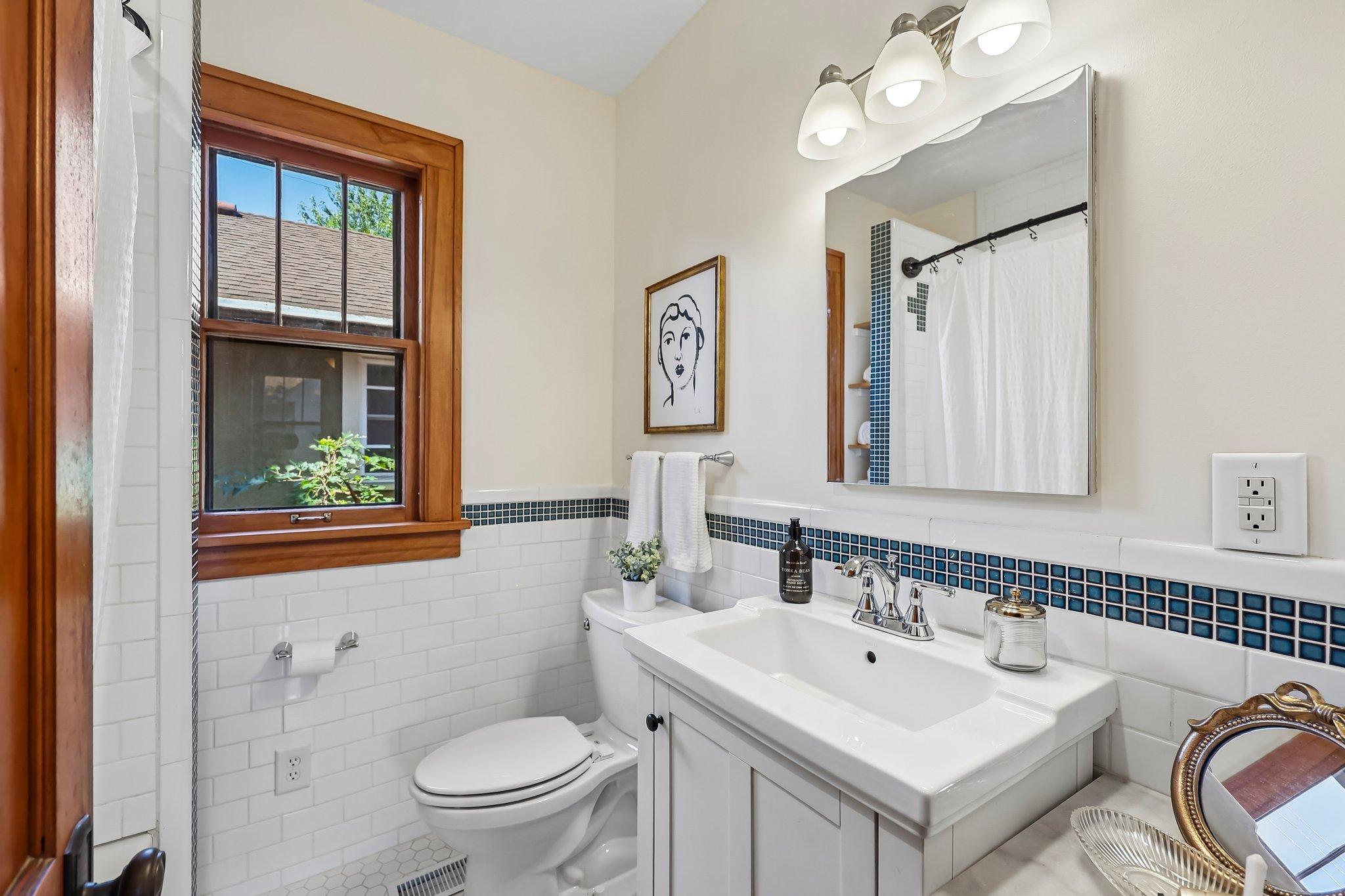 Main level bathroom with custom tile