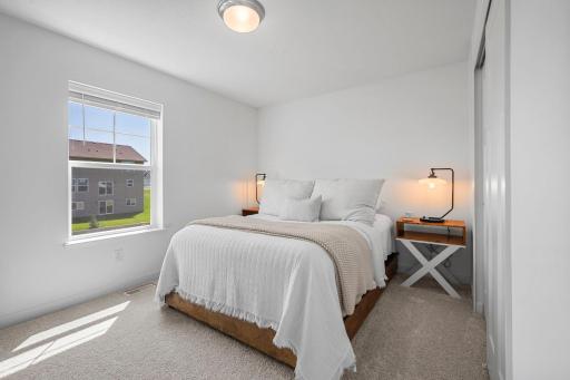 3rd bedroom filled with natural light and finished in easy, neutral tones