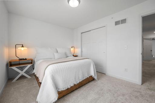 Comfortable bedroom with plush carpeting and a generous closet—ready for family, guests, or a home office