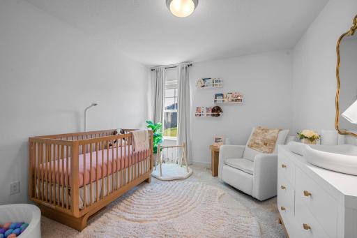 Bright and cheerful 2nd bedroom with soft neutral finishes and plenty of room to make the space your own