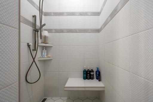 Custom tiled walk-in shower.