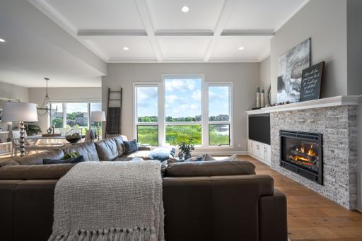 A custom stacked stone fireplace adds warmth and character to the great room. There is a Sonos sound system throughout most of the home.