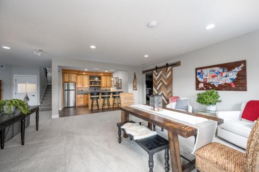 View from patio toward wet bar and 4th bedroom/flex space.