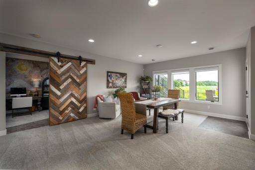 Game space, walk out and custom barn door to the flex space/4th bedroom.