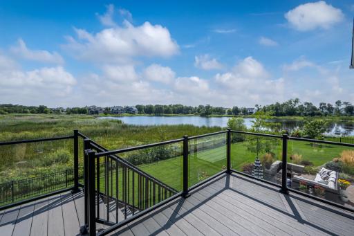The 8x12 deck features composite decking with glass deck railings to maximize your view.