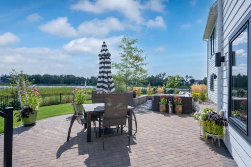 Custom paver patio with several outdoor spaces.