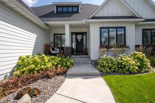 400 series Anderson windows with black exterior/interior sashes and Hardie Board siding.