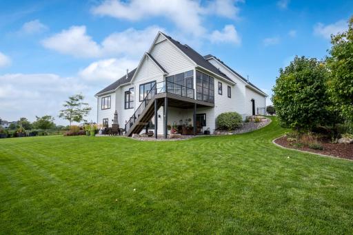 Over 75k in custom landscaping, sprinkler system, patio, curb edging, and fencing by Mickman.