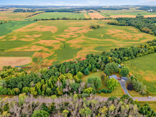 Open landscape surrounds the property.