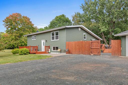 A newer paver patio and covered porch create a welcoming spot to enjoy the outdoors.