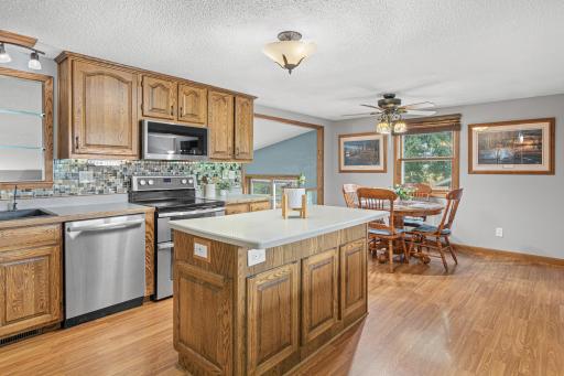 The center island adds an extra spot to prep, serve, or pull up a seat.