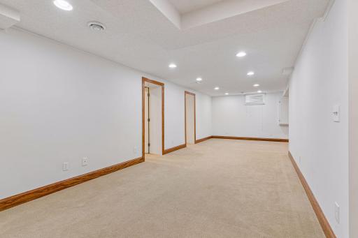 Lower level recreation room with recessed lighting