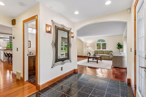 As you enter in the front of the home you are greeted with a wide entry way, half bath and formal living room