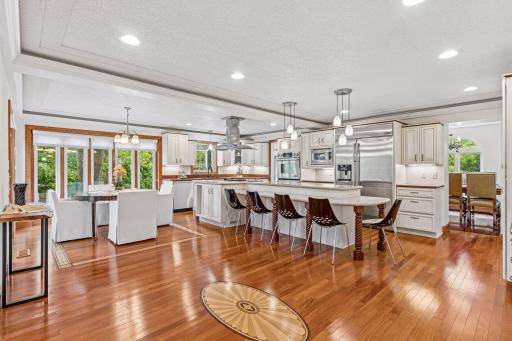 Expansive kitchen is the heart of the home and built for entertaining. Oversized island, stainless steel appliances throughout and tray ceilings make this kitchen shine