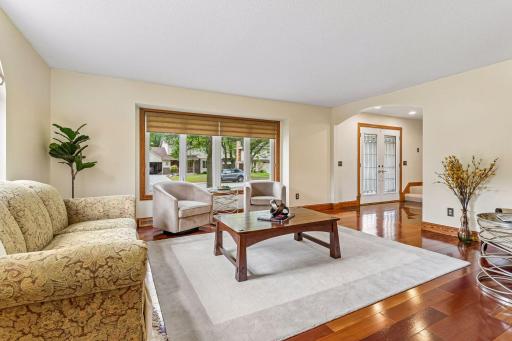 Entire main level features hunter Douglas shades and hardwood flooring throughout