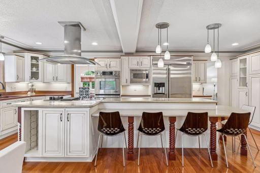 Gourmet kitchen features double ovens, soft close drawers, and stainless steel appliances throughout