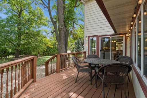 Composite deck with stairs to patio and sliding door access