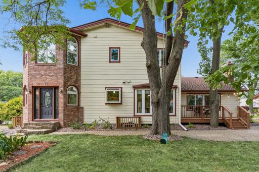 Back of home features with direct office access or access to kitchen off deck and sliding glass door