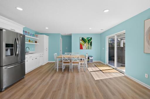 Wet bar and dining area extend the entertaining space
