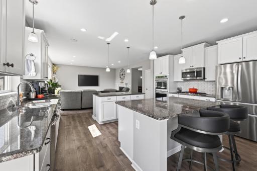Abundant cabinetry and granite countertops