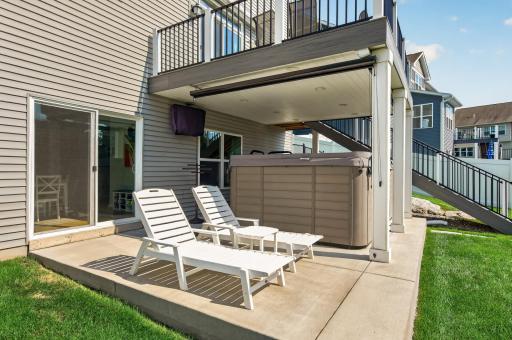 11 person Swim spa with privacy screens creates a backyard retreat
