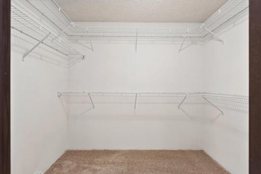 Walk-in closet offers dedicated storage just off the primary ensuite