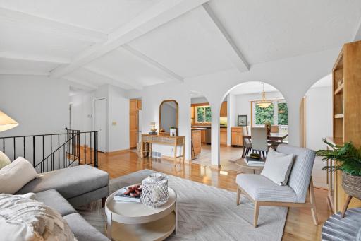 Beautiful archways connect the living and dining spaces while preserving their character
