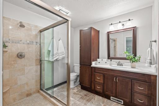 Private primary bath with a beautifully tiled walk-in shower