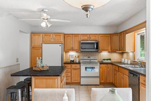 Abundant cabinetry and generous workspace make the kitchen as functional as it is inviting