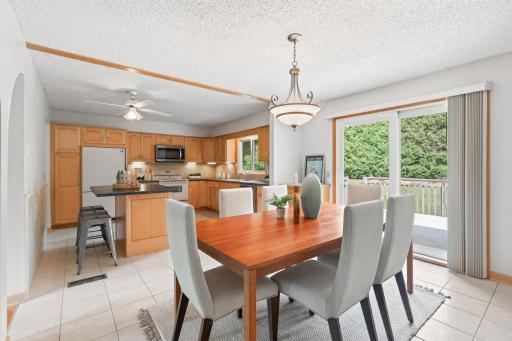 Dining space opens directly to the deck for effortless indoor-outdoor living