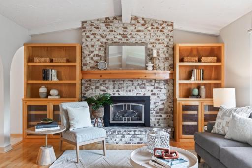 Brick fireplace and built-ins create a striking focal point