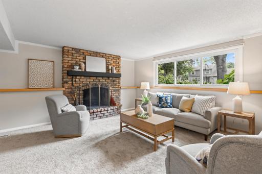 A second brick fireplace anchors the expansive lower-level family room