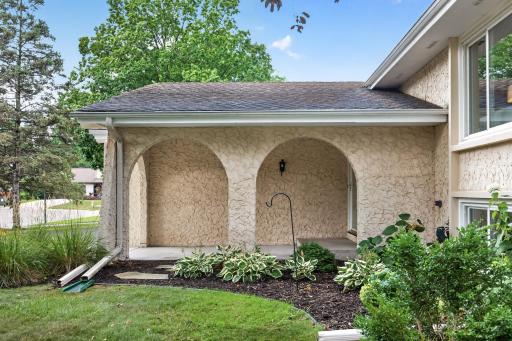 Spanish-inspired stucco and arches give this home character from the start