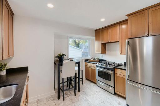 Kitchen is Spacious And Features A Small Eat In Area