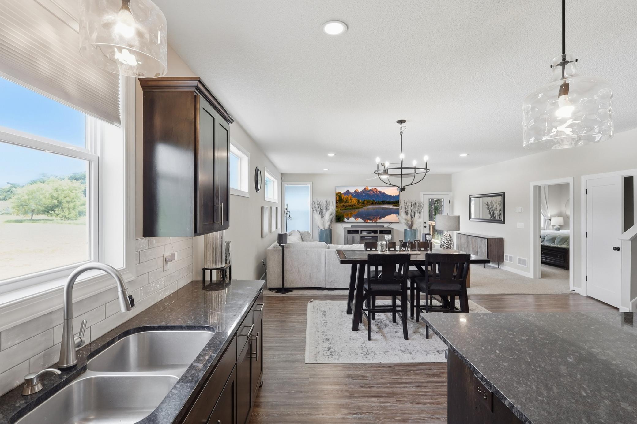 Open-concept floor plan featuring a stunning wall of windows that fills the home with natural light!