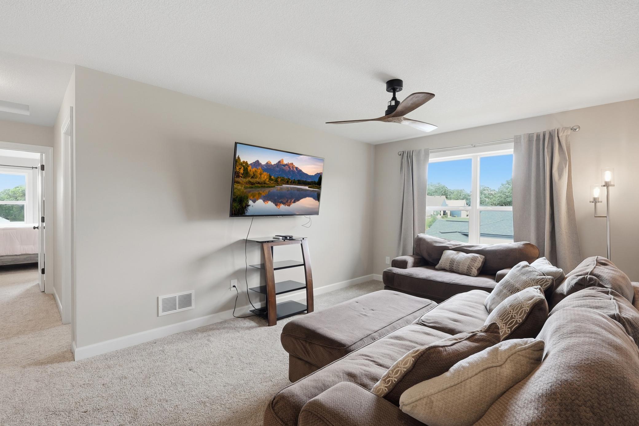 Versatile loft that's perfect for a family room, home office, or play area
