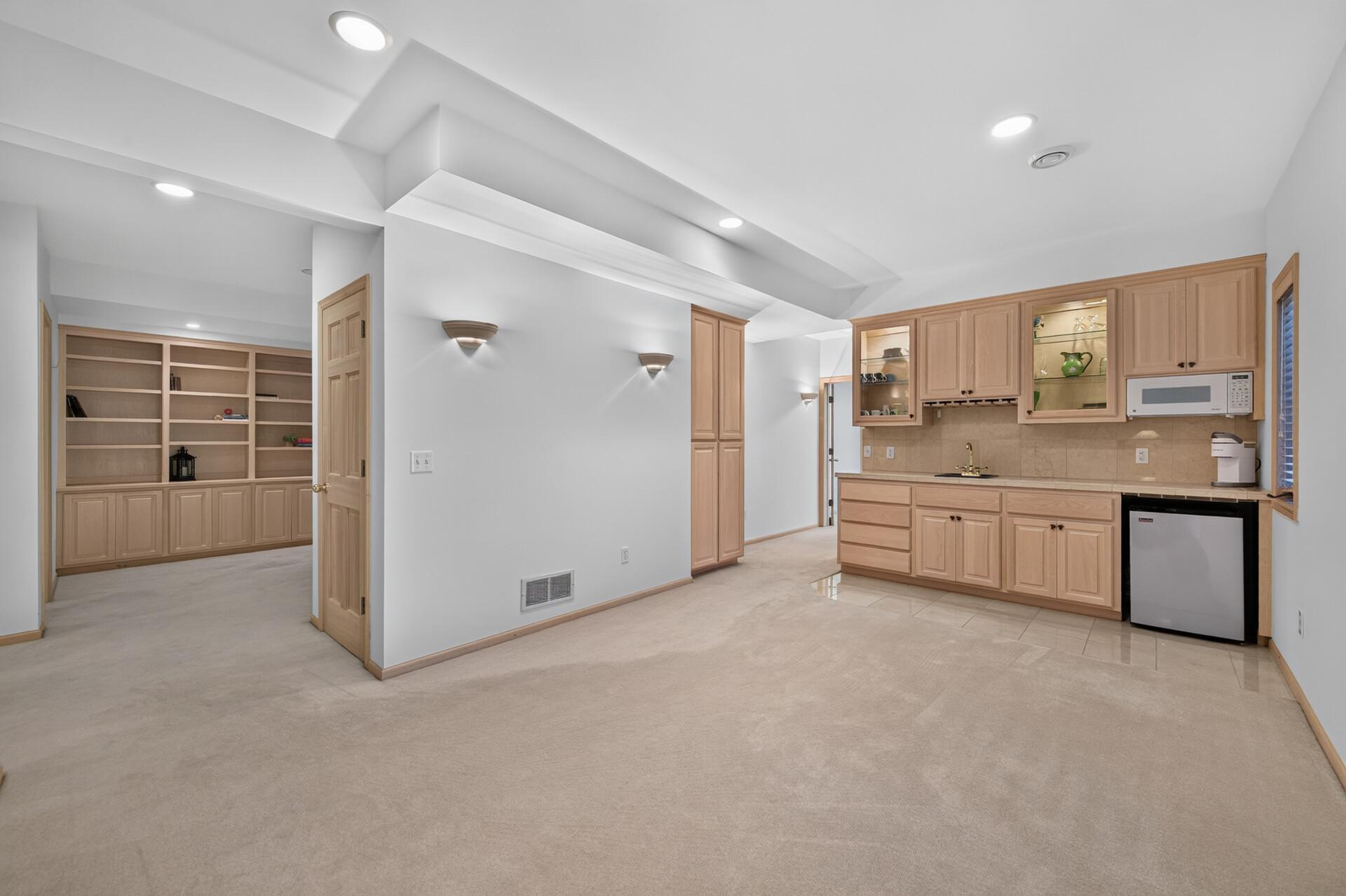 The kitchenette area provides additional space for serving goodies and entertaining.