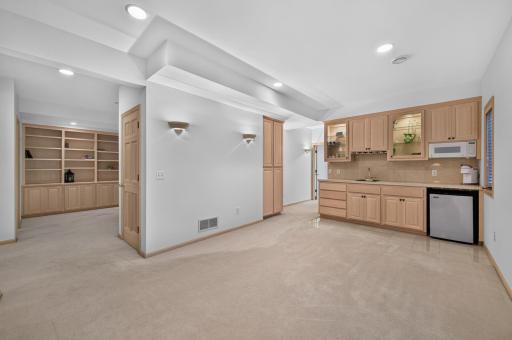 The kitchenette area provides additional space for serving goodies and entertaining.