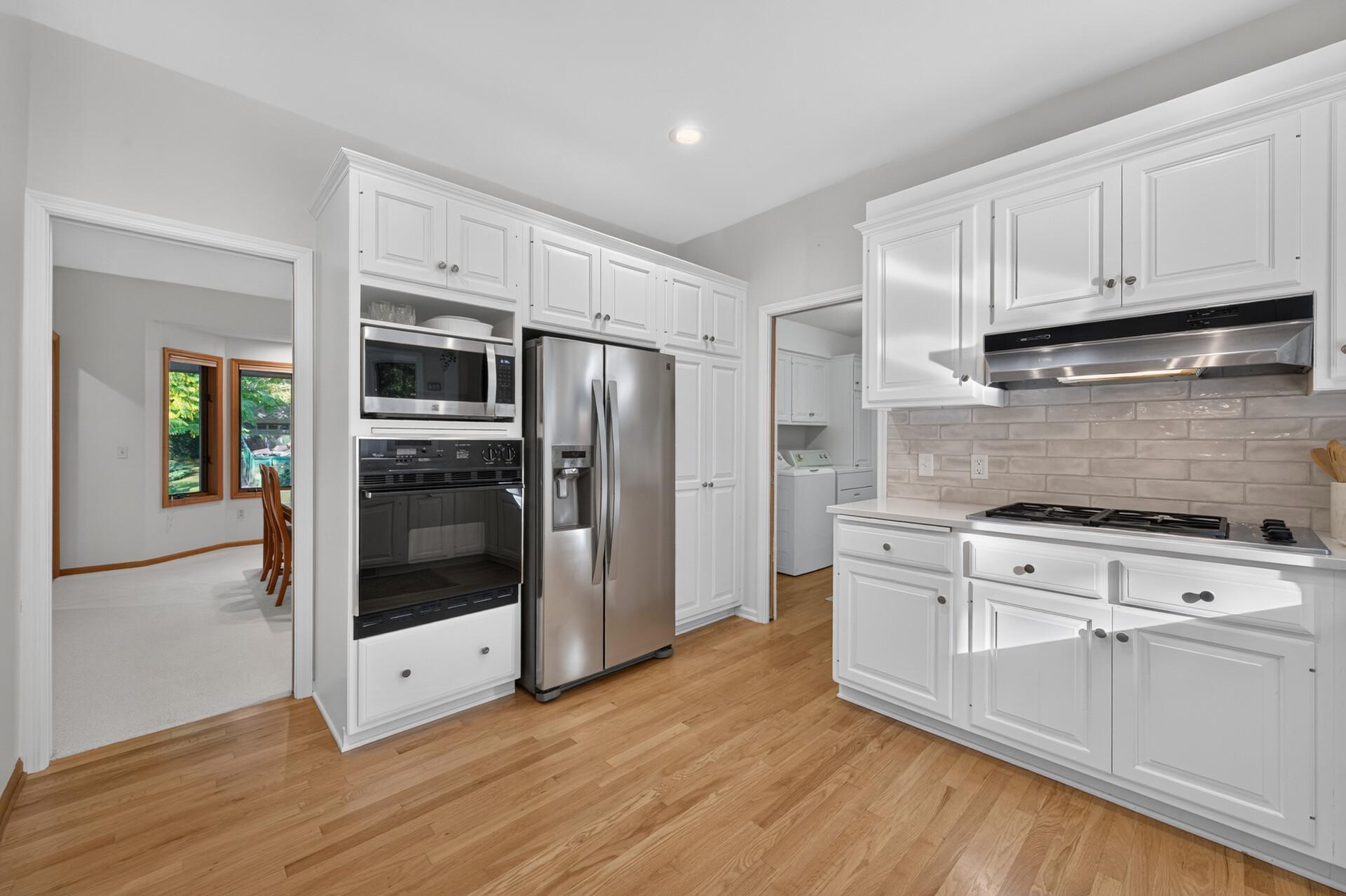 The kitchen opens to the dining room for easy serving.