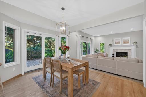 The sliding doors open to a spacious deck in a private and park-like setting.