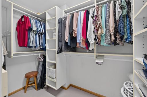 This expansive walk-in closet features a well organized closet system.