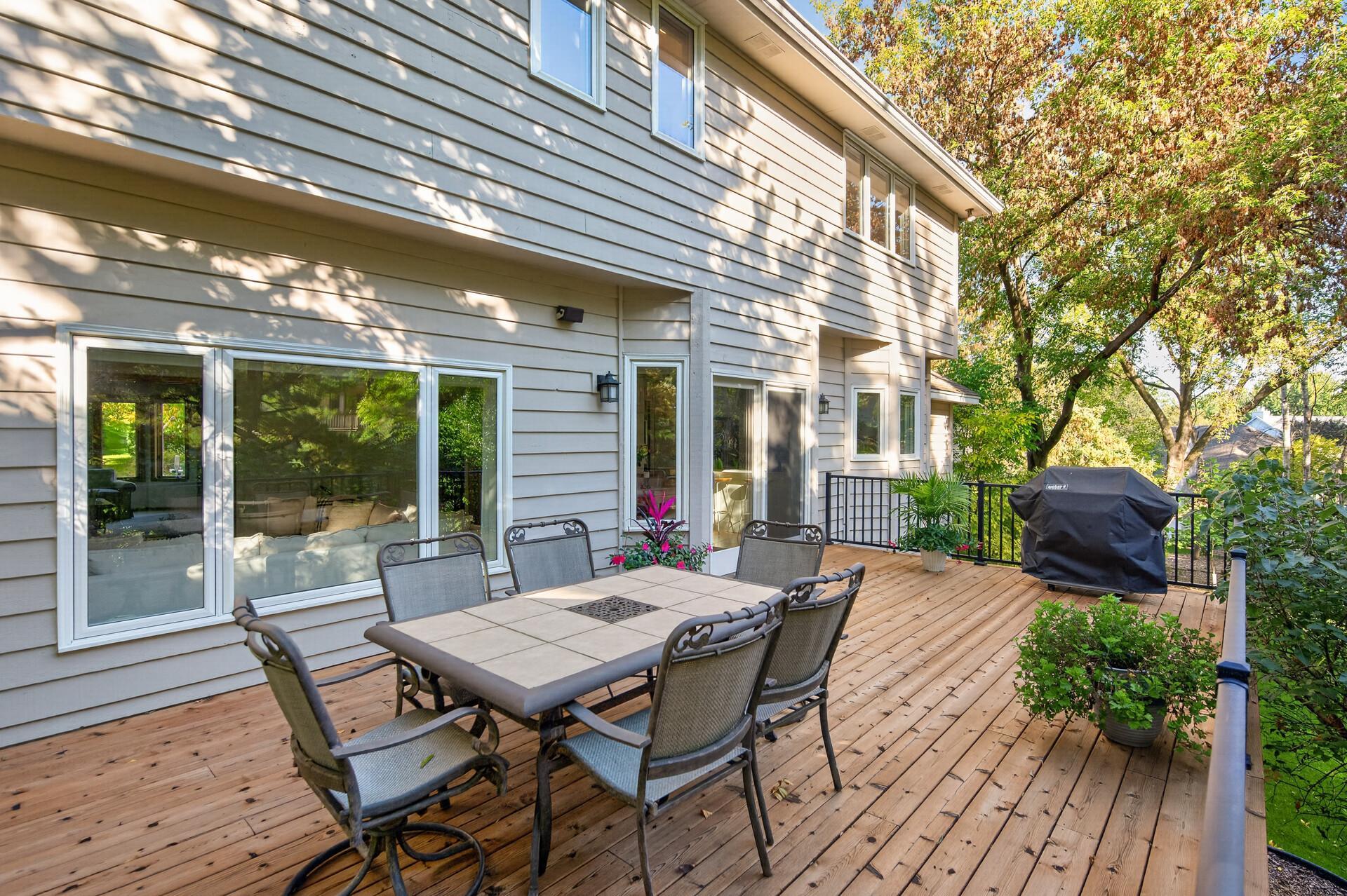 This large deck has space for dining and a conversational gathering area.