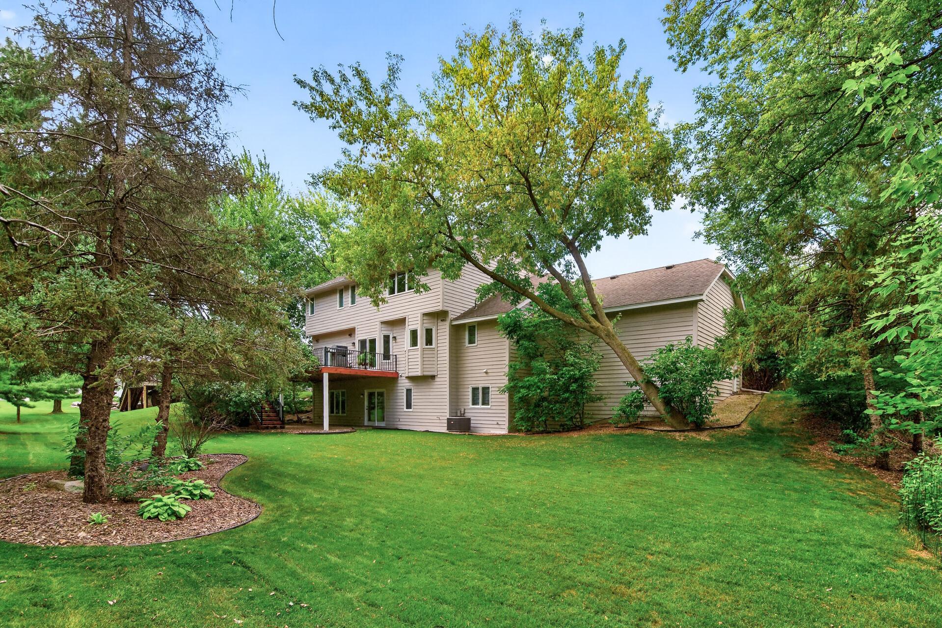 This lovely flat lot has the perfect amount of play space surrounded by trees.
