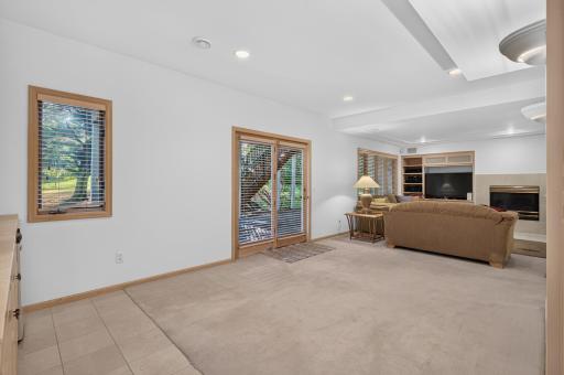The glass doors open to the beautiful backyard and patio area.