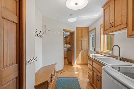 The main floor laundry room is bright and airy and a great landing space off the garage with easy access to the kitchen.
