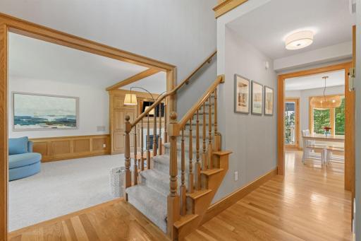 A grand entrance with high ceilings greets you at the entrance with stairs leading to the upper level.