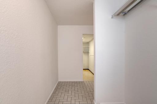 Front hallway - closet doors being installed with easy access to in unit laundry room.jpg