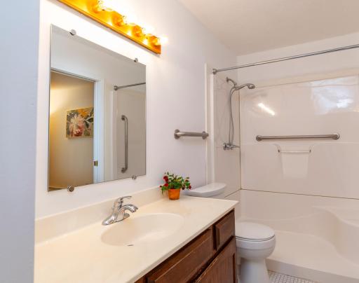 Bath with passthrough door to Bedroom 1.jpg