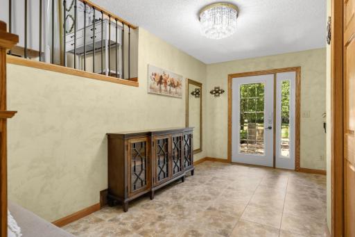 A large foyer warmly welcomes you into the home while providing a practical and functional space for everyday living.