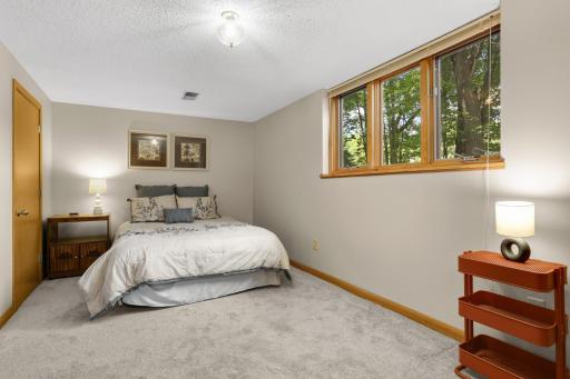 The lower level also offers a large fourth bedroom, 3/4 bathroom, and convenient laundry, providing flexibility for guests, a home office, hobbies, or additional living space.